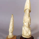 Two African ivory sculptures of male and female portraits, on wooden stands - фото 1