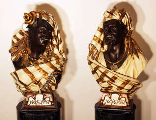 A pair of terracotta busts of Marrocanian couple in traditional dress with jewelry and capes