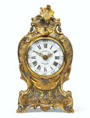 A LOUIS XV GILT AND SILVERED-BRONZE TRAVELING CLOCK