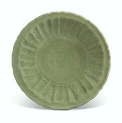 A CHINESE CARVED LONGQUAN CELADON BARBED-RIM DISH