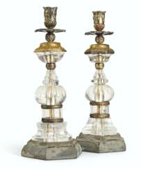A PAIR OF ROCK CRYSTAL, ORMOLU AND SILVERED METAL CANDLESTIC...