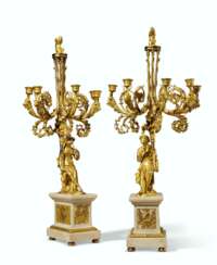 A PAIR OF CHARLES X ORMOLU AND WHITE MARBLE FIVE-LIGHT CANDE...