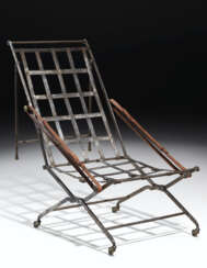A CONSULAT STEEL AND BRASS CAMPAIGN CHAIR