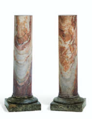 A PAIR OF ITALIAN PURPLE AND YELLOW VEINED MARBLE COLUMNS
