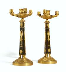 A PAIR OF EMPIRE ORMOLU AND PATINATED-BRONZE FOUR-LIGHT CAND...
