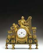 Table clock. A CONSULAT ORMOLU AND VERT DE MER MARBLE MANTEL CLOCK