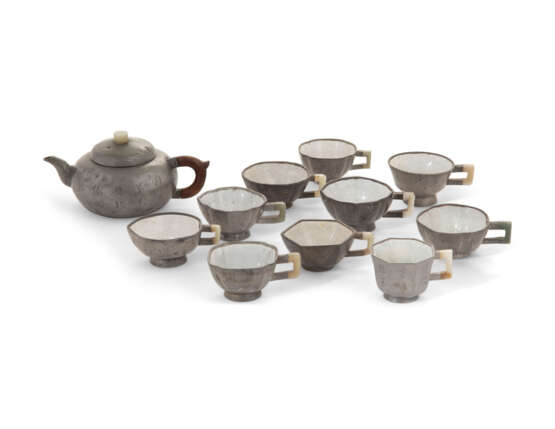 A CHINESE PEWTER-ENCASED YIXING TEAPOT AND TEN PEWTER-ENCASED AND ENAMELLED YIXING CUPS - photo 1