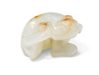 A SMALL CHINESE WHITE JADE DOG CARVING