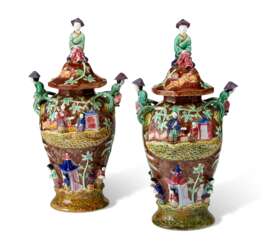 PAIR OF CONTINENTAL MAJOLICA VASES AND COVERS,