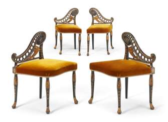 FOUR NORTH EUROPEAN BLACK-PAINTED AND PARCEL GILT SIDE CHAIRS