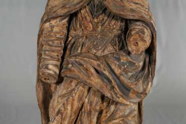 Large carved Saint statue in case