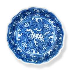 A SMALL BLUE AND WHITE FOLIATE-RIMMED 'HEAVENLY HORSE' DISH