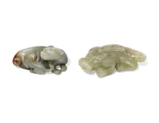 A YELLOW JADE CARVING OF A MYTHICAL BEAST AND A GREENISH-WHITE JADE 'FELINE' GROUP