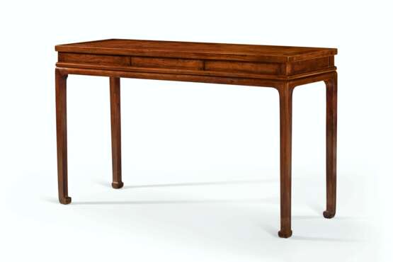 A HUANGHUALI THREE-DRAWER CORNER-LEG DESK, SHUZHUO - photo 2