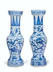 A PAIR OF BLUE AND WHITE TEMPLE VASES
