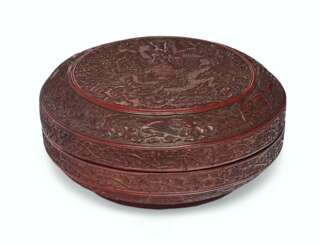 A RED LACQUER 'DRAGON' BOX AND COVER