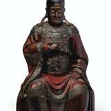 A LARGE CARVED AND LACQUERED WOOD FIGURE OF A SEATED OFFICIA... - фото 1