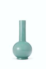 AN OPAQUE TURQUOISE GLASS BOTTLE VASE