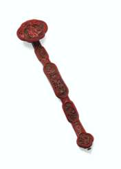 A FINELY CARVED THREE-COLOR LACQUER RUYI SCEPTER