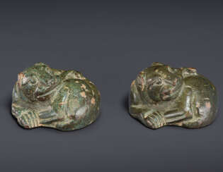 A PAIR OF BRONZE COILED TIGER-FORM WEIGHTS