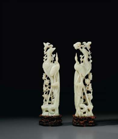 A PAIR OF LARGE PALE GREENISH-WHITE JADE FIGURES OF PHOENIXE... - photo 1