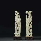 A PAIR OF LARGE PALE GREENISH-WHITE JADE FIGURES OF PHOENIXE... - фото 1