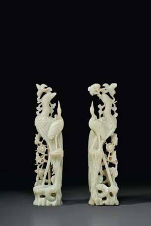 A PAIR OF LARGE PALE GREENISH-WHITE JADE FIGURES OF PHOENIXE... - photo 2