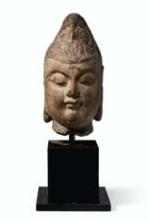 A CARVED MARBLE HEAD OF A BODHISATTVA