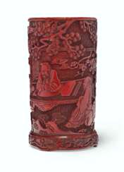 A CARVED RED LACQUER BRUSH POT