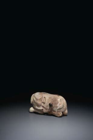 A 'CHICKEN BONE' JADE CARVING OF AN ELEPHANT - photo 1
