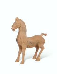 A LARGE PAINTED GREY POTTERY FIGURE OF A HORSE