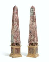 A PAIR OF ITALIAN RED AND YELLOW MARBLE OBELISKS