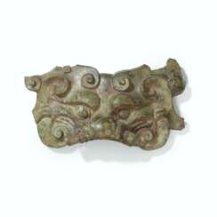 A BRONZE TAOTIE MASK-FORM FITTING