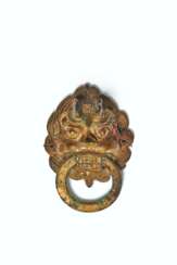 A GILT-BRONZE LEONINE MASK-FORM FITTING WITH LOOSE RING