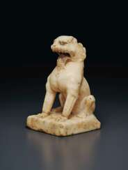 A SMALL WHITE MARBLE FIGURE OF A SEATED LION