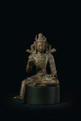 A SILVER-INLAID BRONZE FIGURE OF MAITREYA