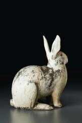 A CARVED WOOD MODEL OF A HARE