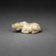 A WELL-CARVED BEIGE AND BROWN JADE FIGURE OF A RECUMBENT WATER BUFFALO - фото 1