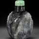 A RARE AND FINELY CARVED BLACK AND WHITE JADE SNUFF BOTTLE - photo 1