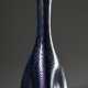 Schlanke Loetz Wwe. Vase mit dreifach gedelltem Korpus und blau lustrierendem Wellendekor, H. 24,8cm, Abriss ausgeschliffen, Standfläche berieben, 2 Luftblasen in der Glasmasse - photo 1