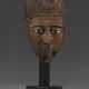 AN EGYPTIAN GLASS, BONE AND BRONZE-INLAID WOOD FACE FROM A COFFIN - фото 1