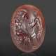 A GREEK GARNET RINGSTONE WITH ZEUS, HERMES AND THE INFANT DIONYSOS - photo 1