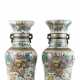 Pair of polychrome porcelain vases decorated with battle scenes in a mountain landscape, bearing the apocryphal mark - photo 1
