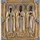 AN ICON SHOWING STS. MAKARI, JOANNICIUS THE GREAT AND SAVVA WITH SILVER-GILT AND CHAMPLEVÉ ENAMEL OKLAD - фото 1