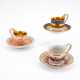 THREE PORCELAIN CUPS AND MATCHING SAUCERS WITH DIFFERENT ORNAMENTATION AND GROUND DECORS - photo 1