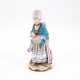PORCELAIN FIGURINE OF A LADY WITH A MUFF - photo 1