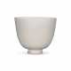 A LARGE HIGH-FIRED WHITE-GLAZED CUP - фото 1