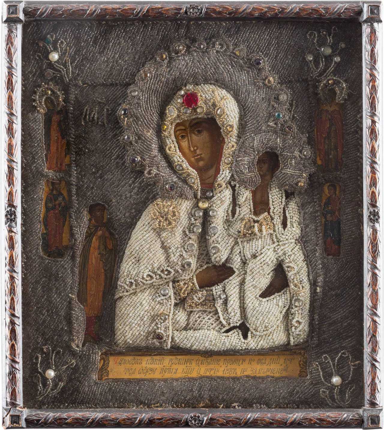 AN ICON SHOWING THE MOTHER OF GOD OF 'UNEXPECTED JOY' WITH EMBROIDERED