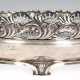 Jugendstil-Schale, 800er Silber, oval, mit floral durchbrochenem Rand, auf 4 Füßen, 2 reliefierte Handhaben, 1 kl. Delle, 539 g, 9,5x35,5x18,5 cm - фото 1