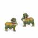 A PAIR OF GREEN, YELLOW AND AUBERGINE-GLAZED BISCUIT BUDDHIST LIONS - фото 1